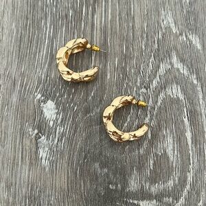 Women’s gold hoop earrings